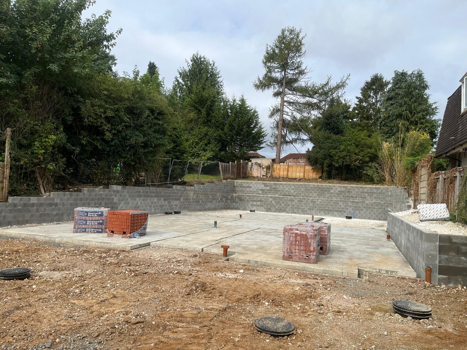 A concrete block being constructed in a backyard as part of a groundworks project by Fost & Co.